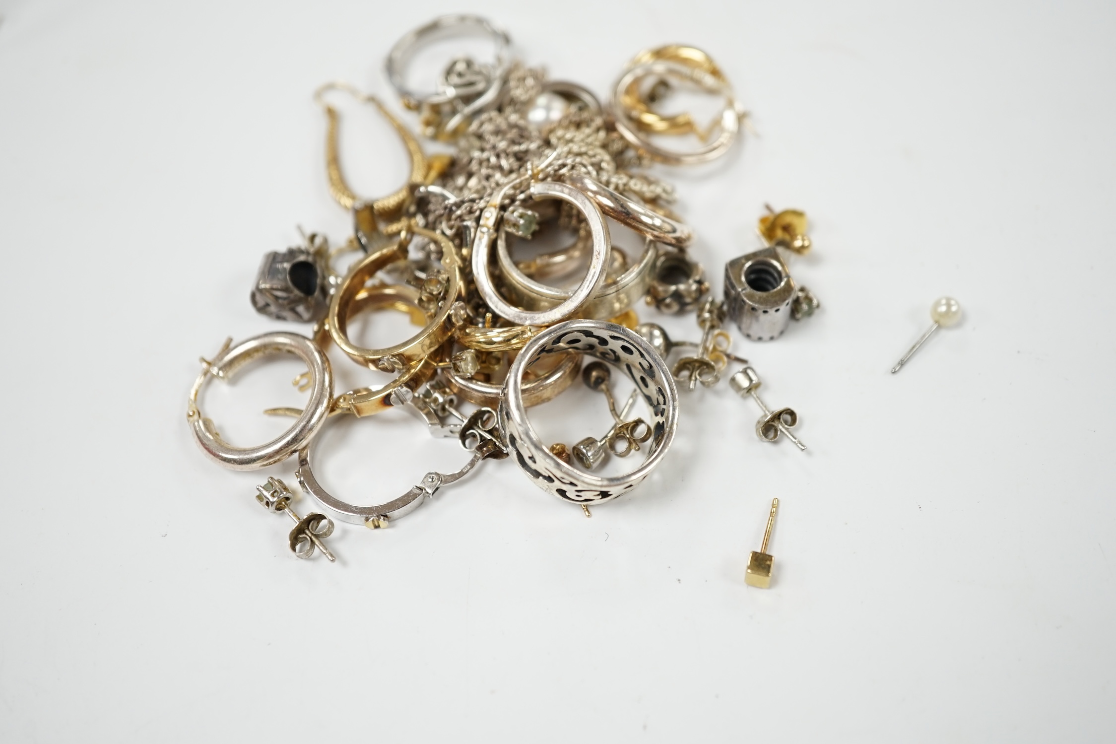 Four assorted pairs of modern 9k earrings, a 9ct white gold band, gross 10.8 grams and a small quantity of 925 jewellery. Condition - poor to fair